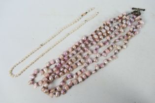 A rice pearl necklace with clasp stamped