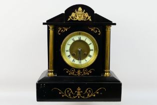 A 19th century black slate mantel clock