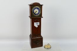 A vintage mantel or desk clock in the fo