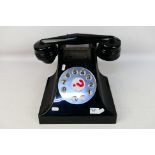 A large Deal Or No Deal model telephone, approximately 24 cm x 40 cm x 34 cm.