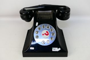 A large Deal Or No Deal model telephone, approximately 24 cm x 40 cm x 34 cm.