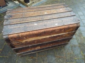 A late 19th/early 20thC domed top trunk with wooden slats,
