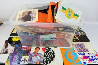 A large quantity of 7" vinyl records, various genres and artists.