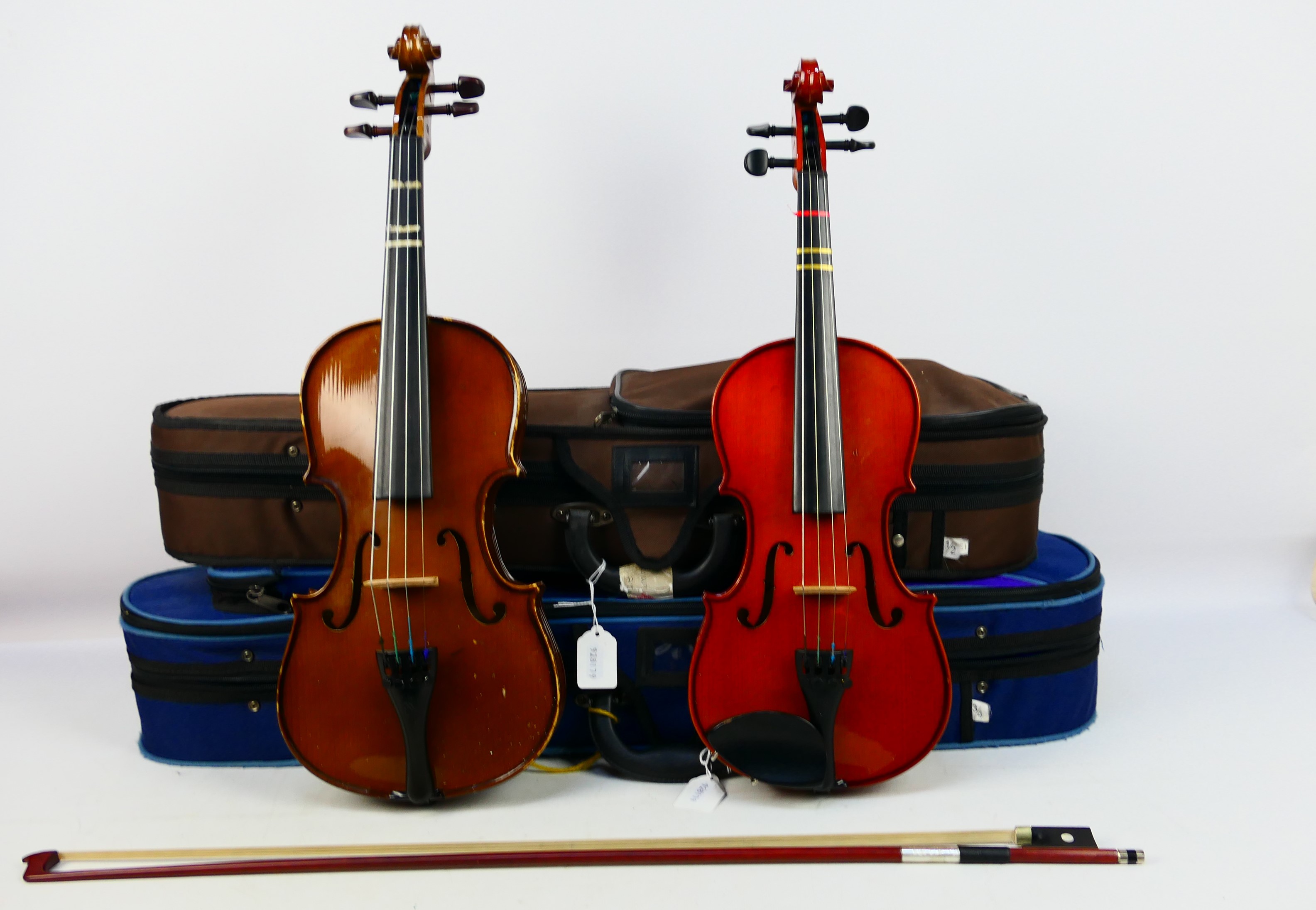 Two cased violins comprising a Stentor Student ST and a Stentor Student I,