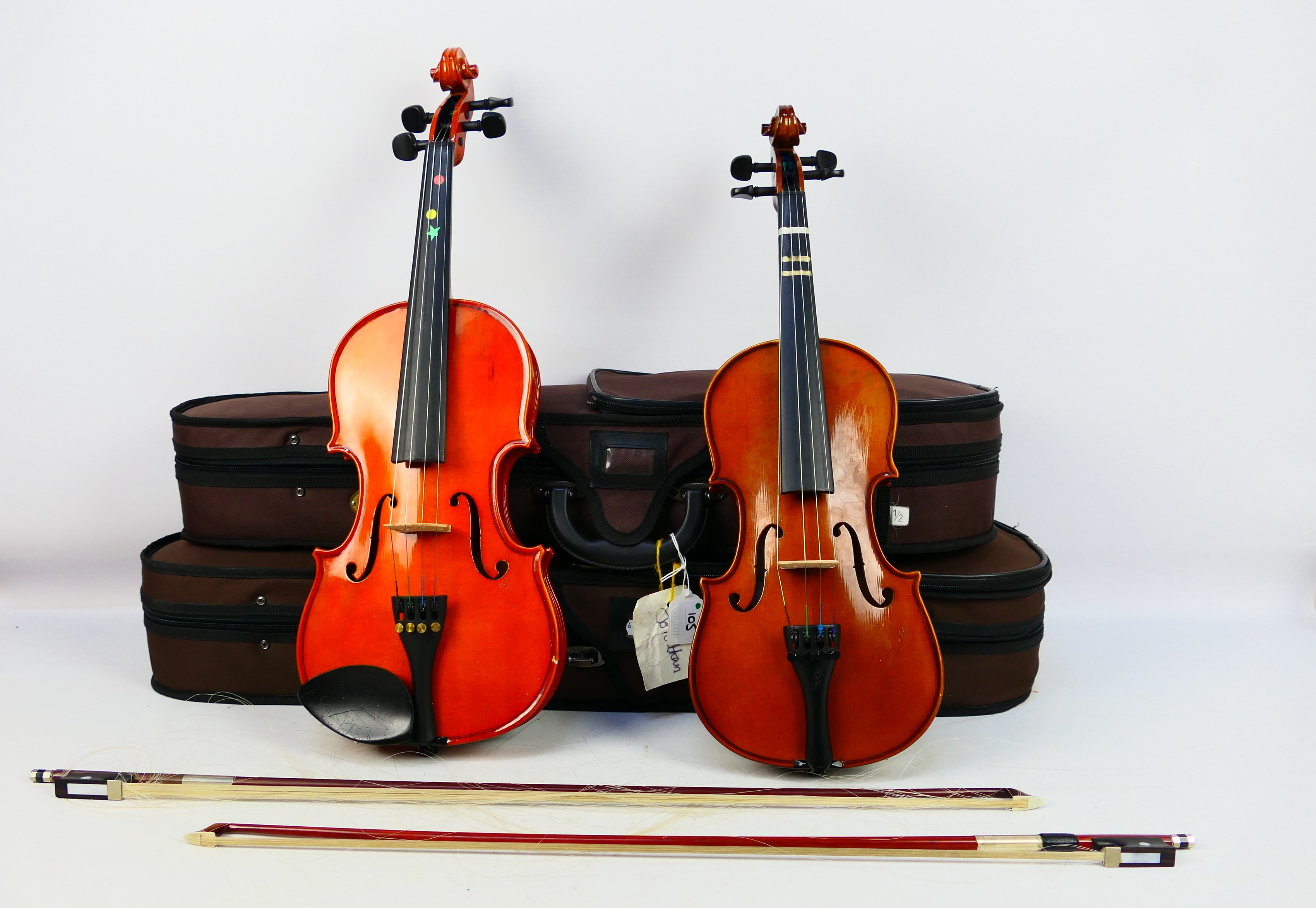 Two cased violins comprising a Stentor Student ST and a Stentor Student Standard,