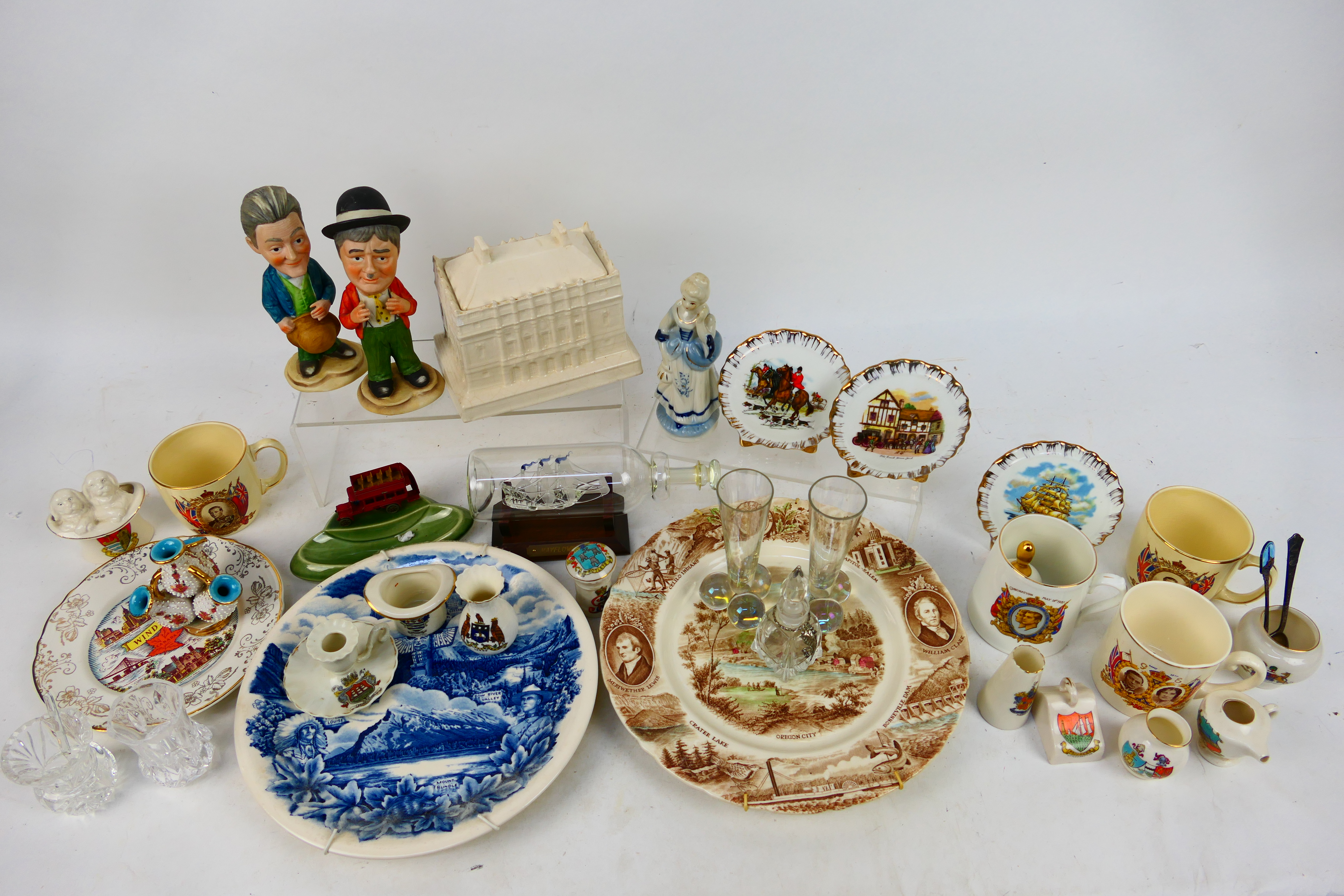 A collection of ceramics and glass to include Laurel & Hardy figures, crested ware,