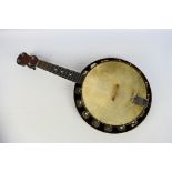 A vintage, four string banjolele, unknown maker, contained in fitted case.