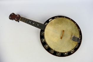A vintage, four string banjolele, unknown maker, contained in fitted case.