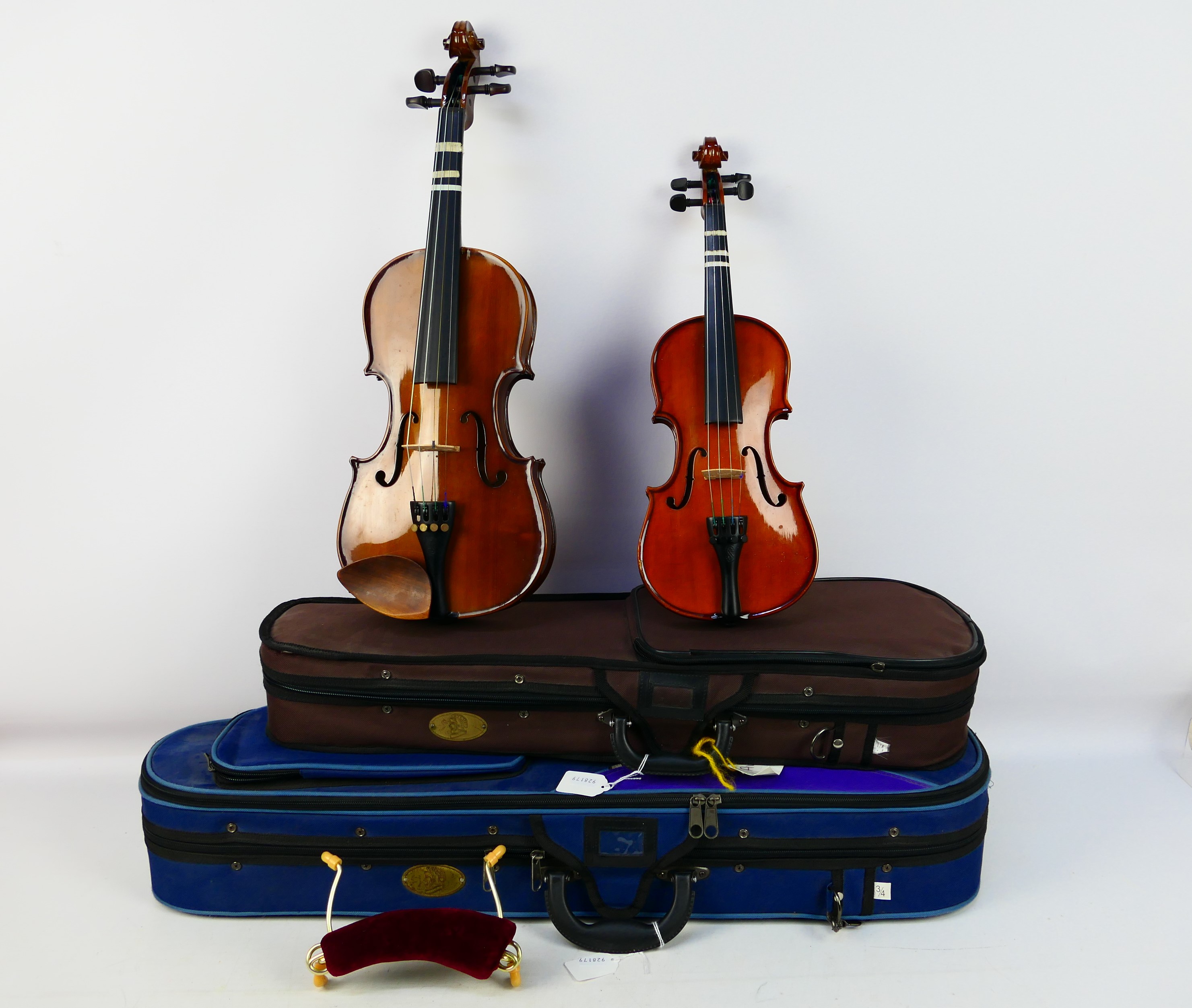 Two violins comprising a Stentor Student ST and a Stentor Student I, contained in carry cases. [2].