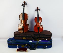 Two violins comprising a Stentor Student ST and a Stentor Student I, contained in carry cases. [2].