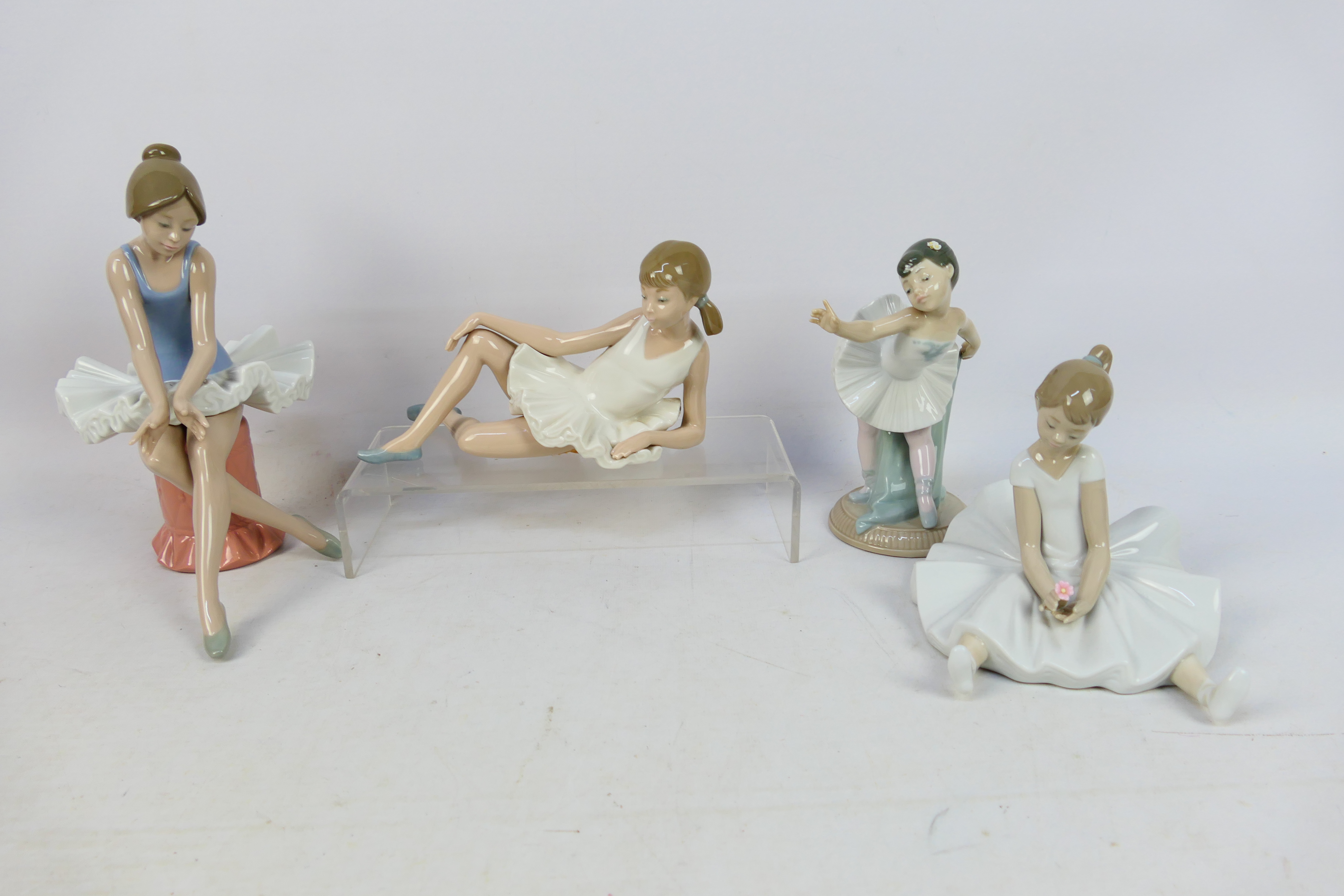 Four Nao figures of ballerinas, largest approximately 23 cm (h).
