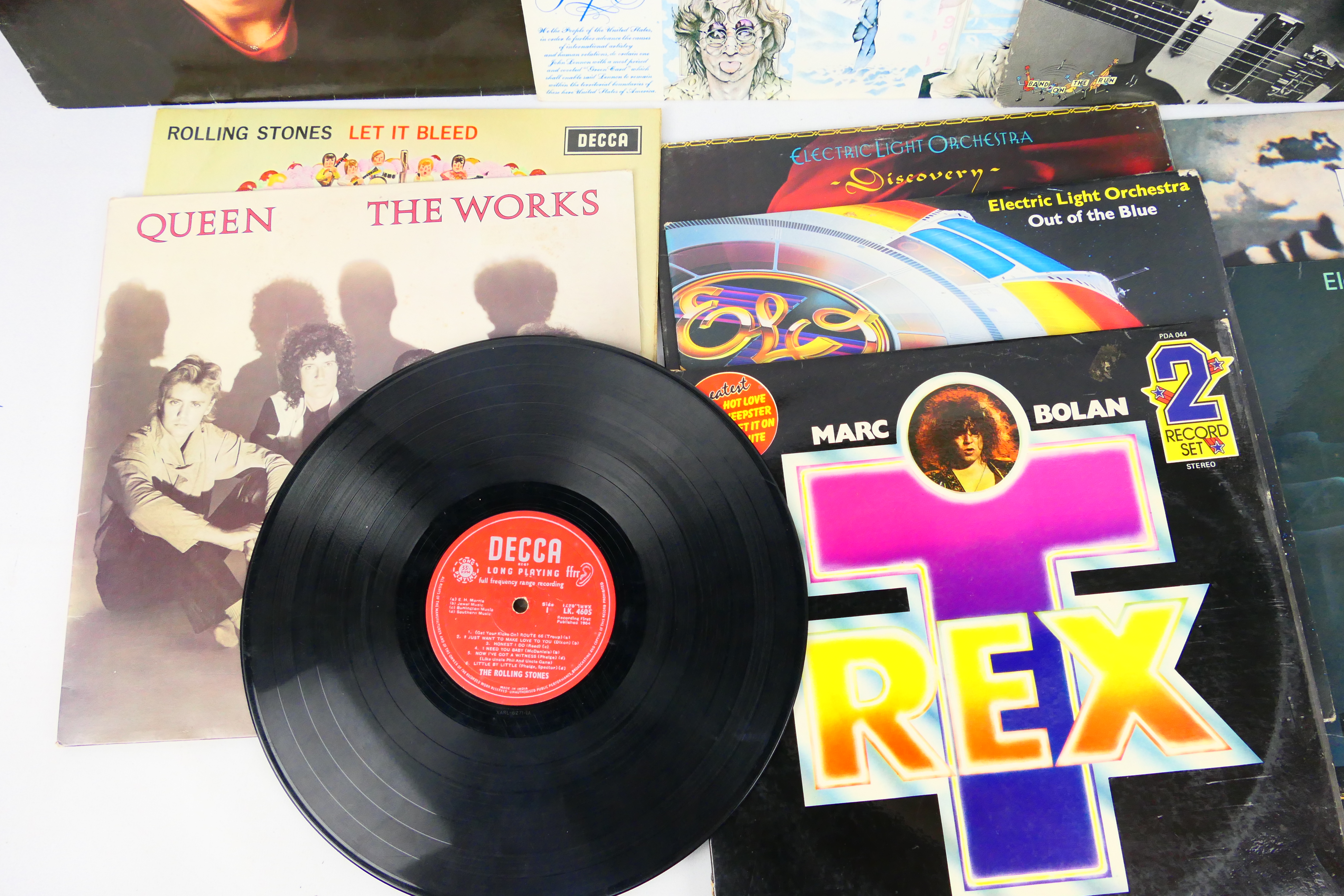 A collection of 12" vinyl records to include Rolling Stones, Queen, ELO, John Lennon, - Image 2 of 4