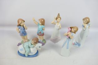 A collection of Nao figures including one Disney Collection example,