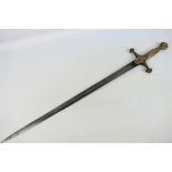 A 19th century brass hilted sword, 65 cm (l) blade,