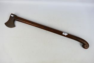 A 19th century military felling type axe, possibly French, 79 cm (l) and 13 cm (l) head.