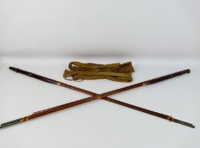 Two J Peek & Son three piece fishing rods contained in canvas bags.