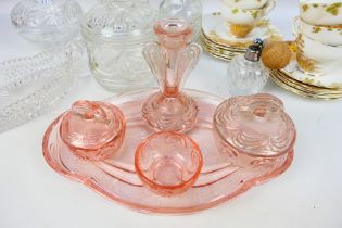 A quantity of glassware to include peach glass dressing table set,