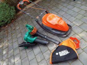 A Flymo Easi Glide 330 lawn mower and a Black and Decker leaf blower type 4