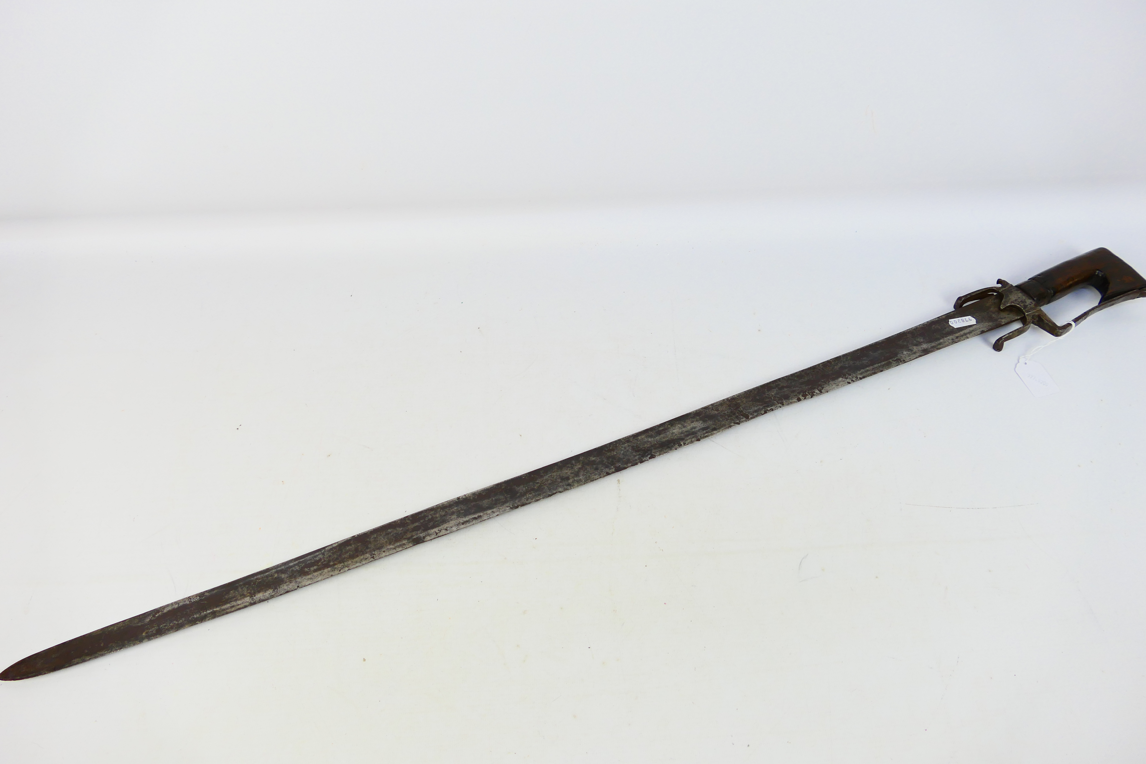 A late 18th or early 19th century North African Nimcha type sword, 93 cm (l) single edged blade,