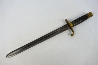 An antique naval dirk, possibly French, with 32 cm (l) fullered blade, brass cross guard and pommel,