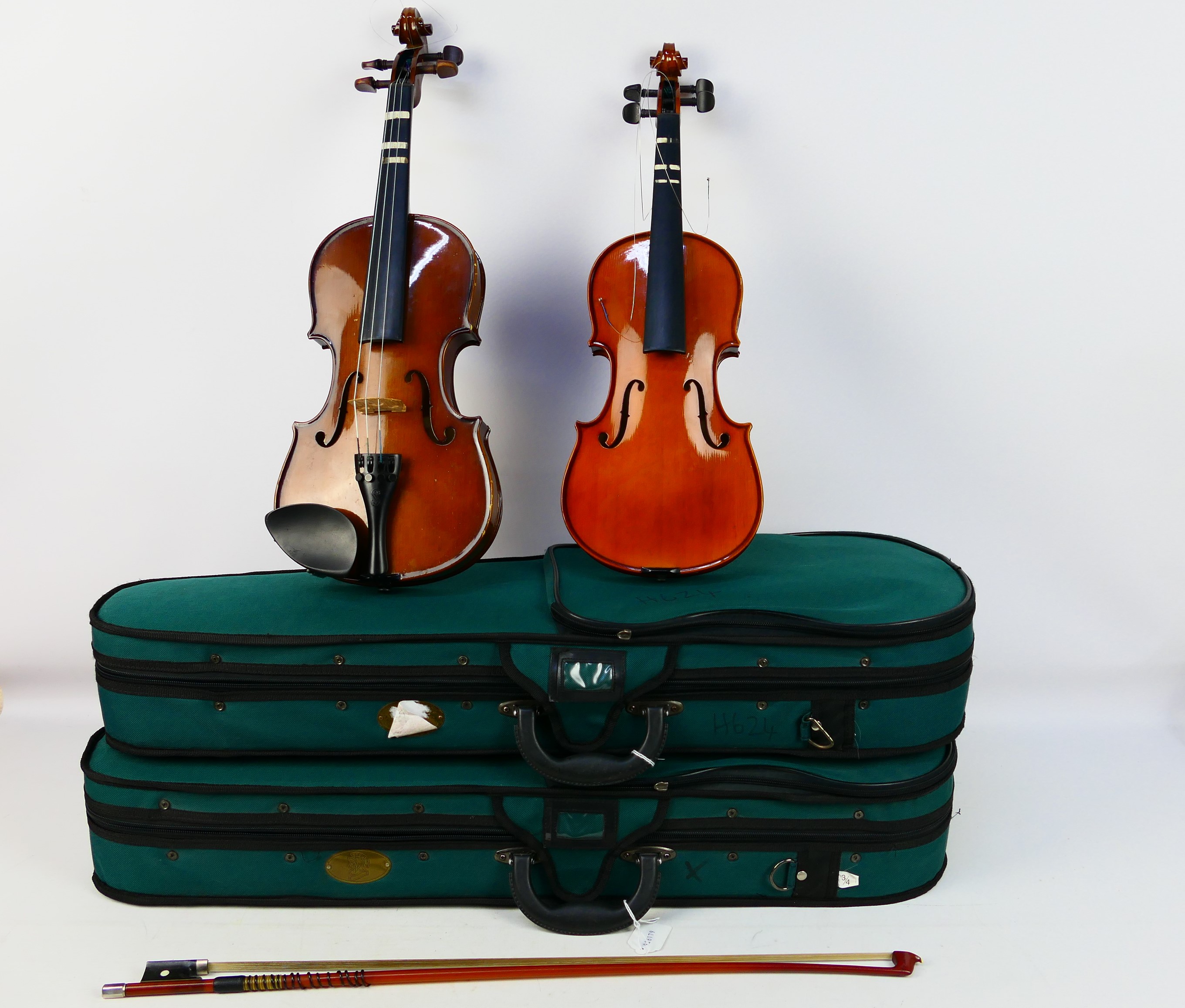 Two cased violins comprising a Stentor Student ST and a Stentor Student I,