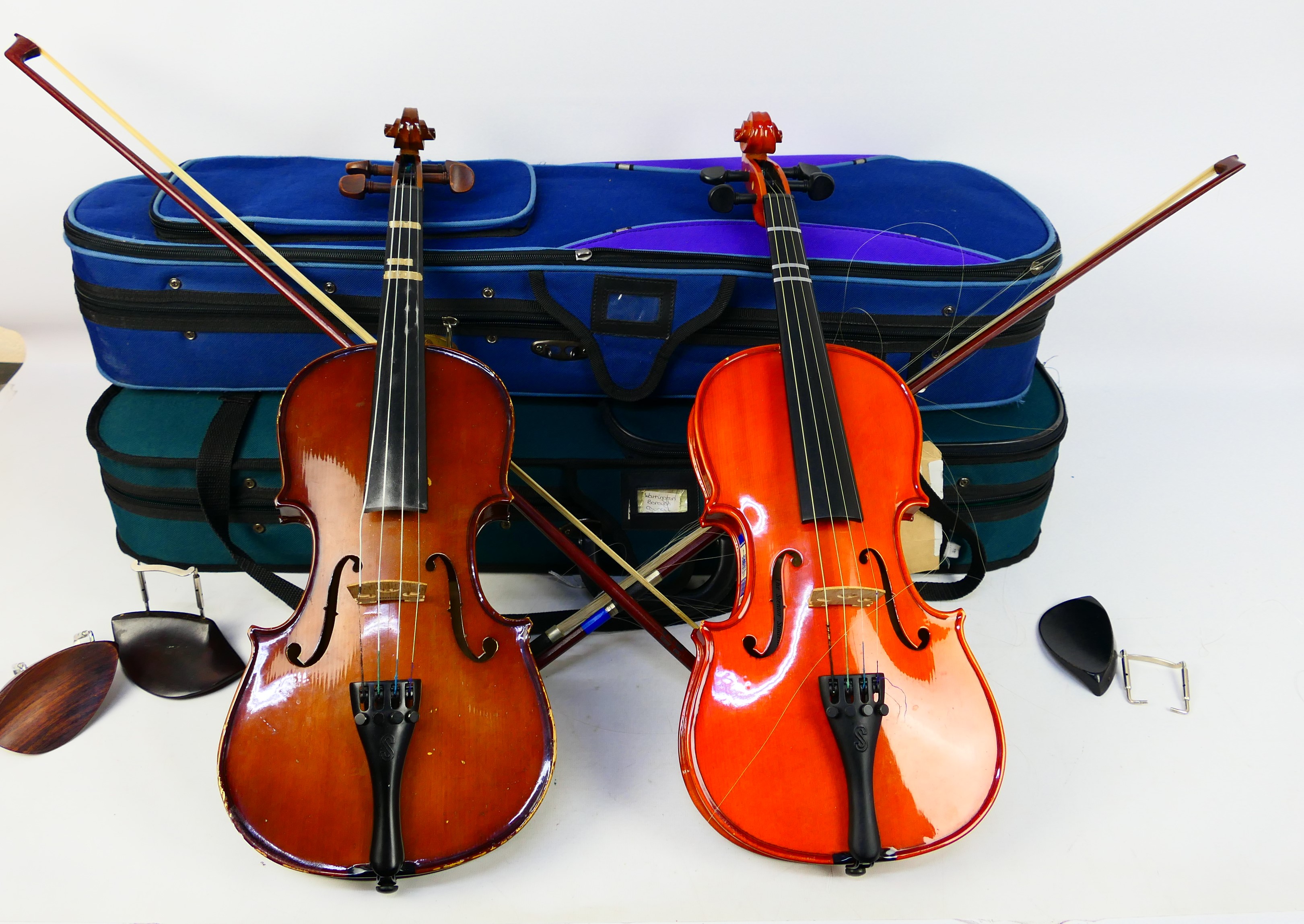 Two cased violins comprising a Stentor Student ST and a Stentor Student I,