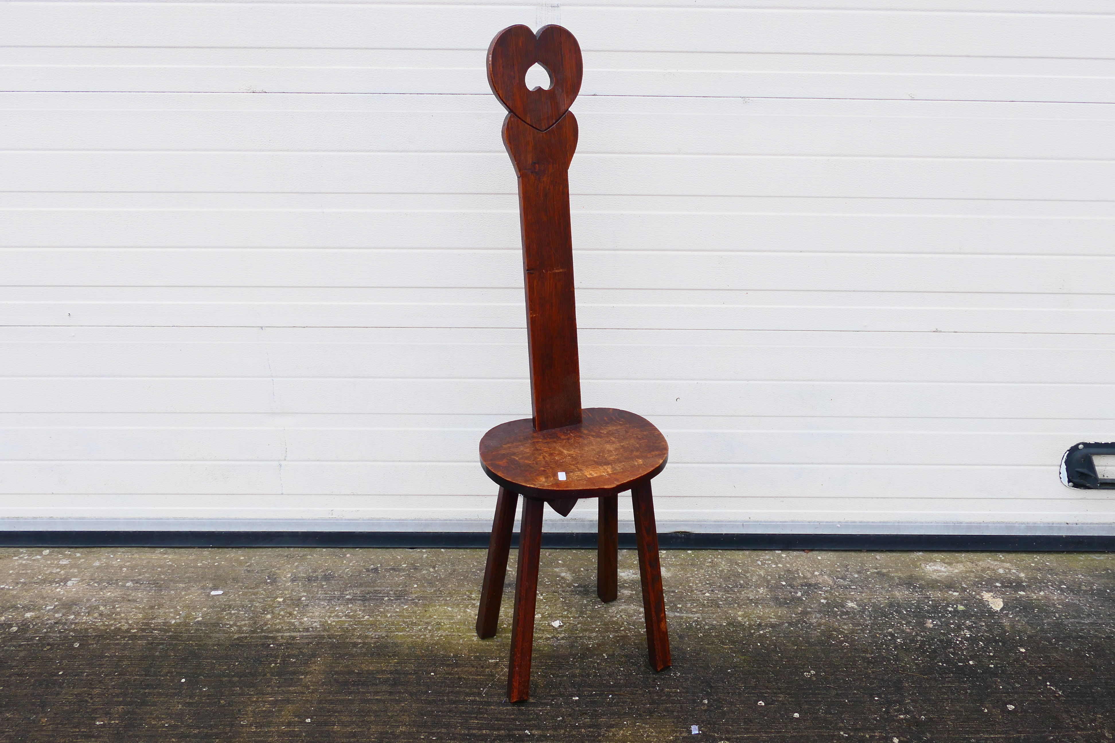 A wooden spinning chair with heart-shaped design. 120 cm (h) x 31 cm (d) x 35 1/2 cm (w). - Image 2 of 6