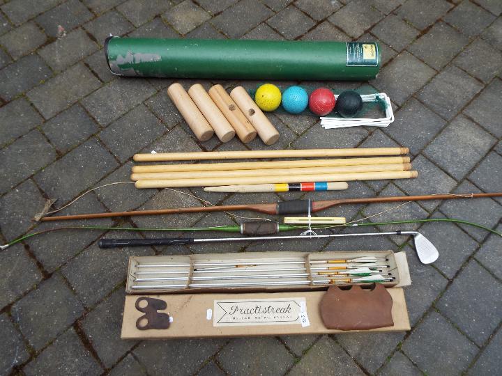 Outdoor sports - a garden croquet set by Debenhams, six tubular metal arrows by Practistreak,