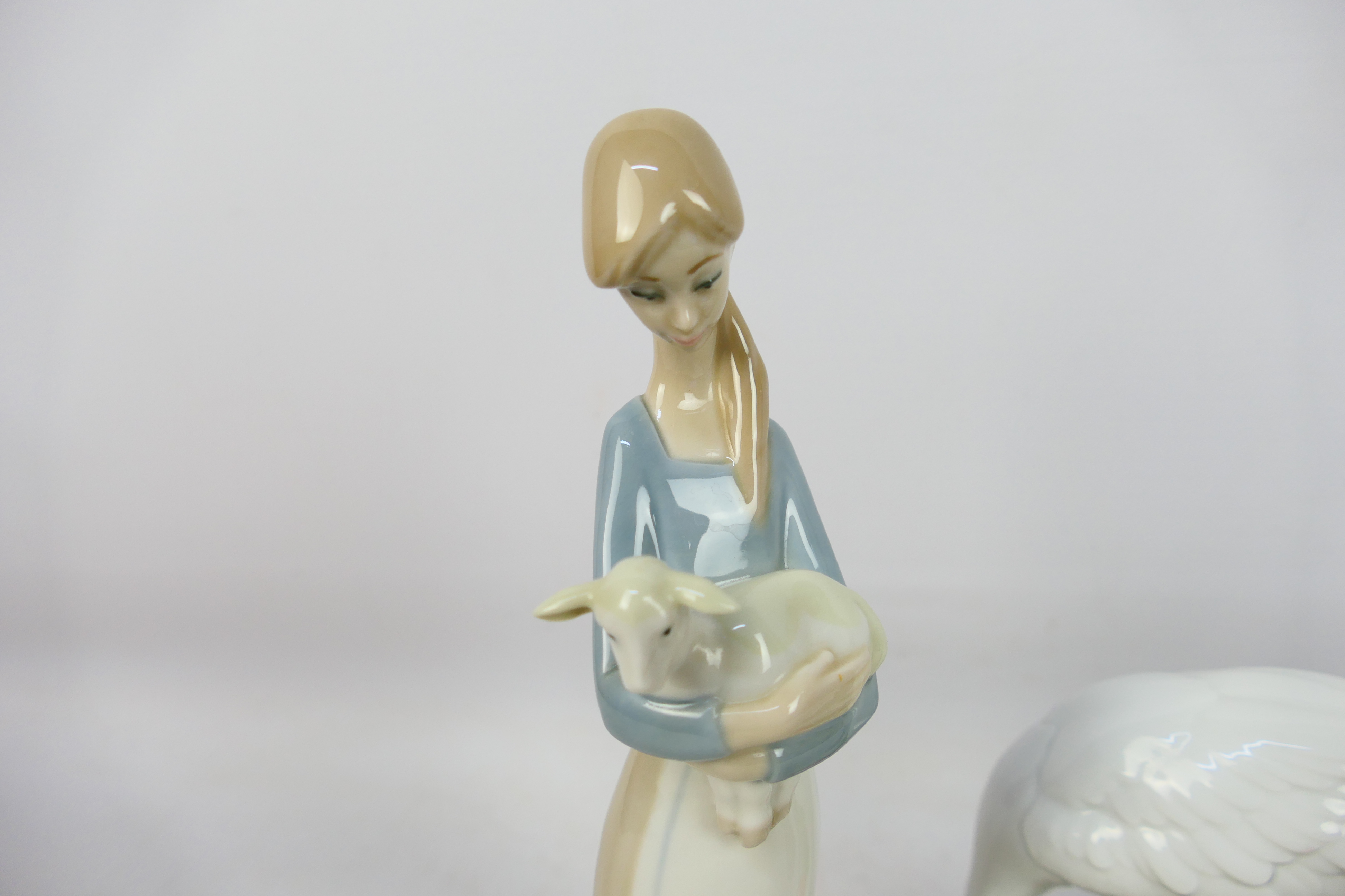 Lladro - Three figures comprising two Red-crowned crane studies and a girl carrying a lamb, - Image 2 of 5