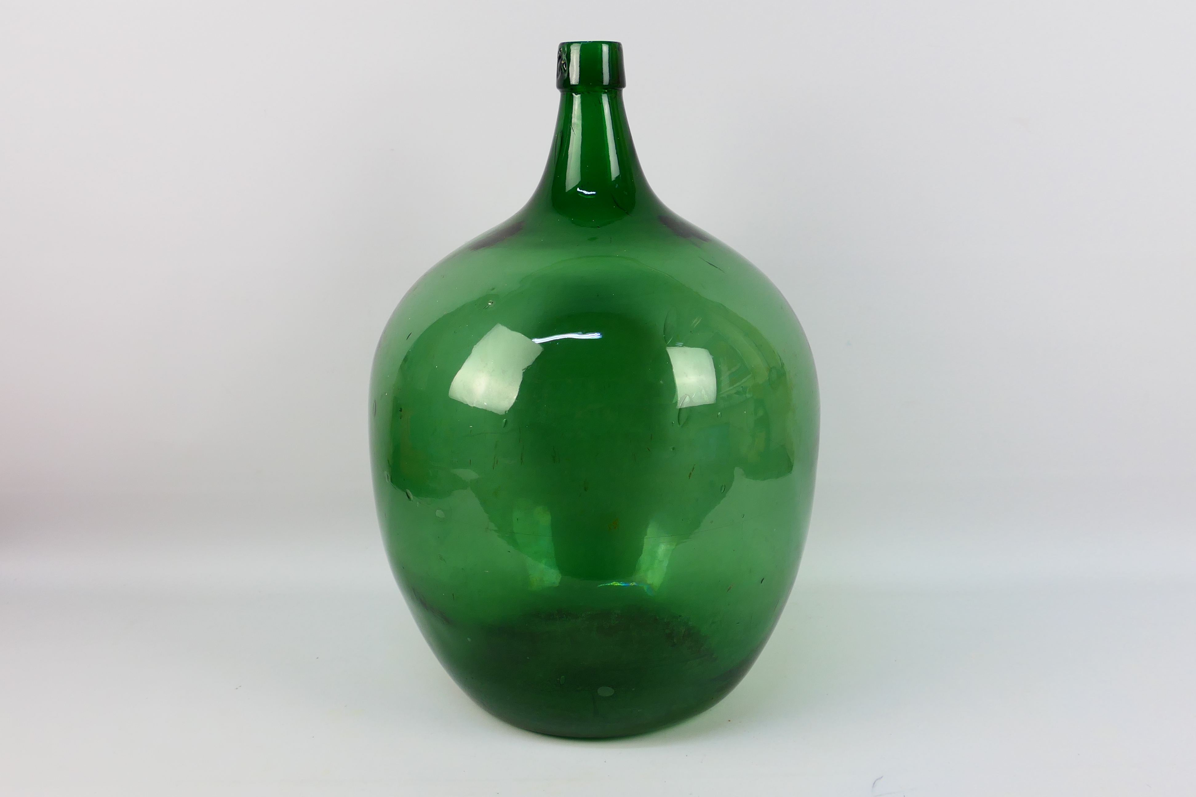 A large green glass carboy, approximately 50 cm (h).