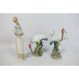 Lladro - Three figures comprising two Red-crowned crane studies and a girl carrying a lamb,