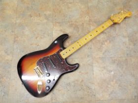 A Stratocaster shaped electric Guitar marked Fender with maple neck,