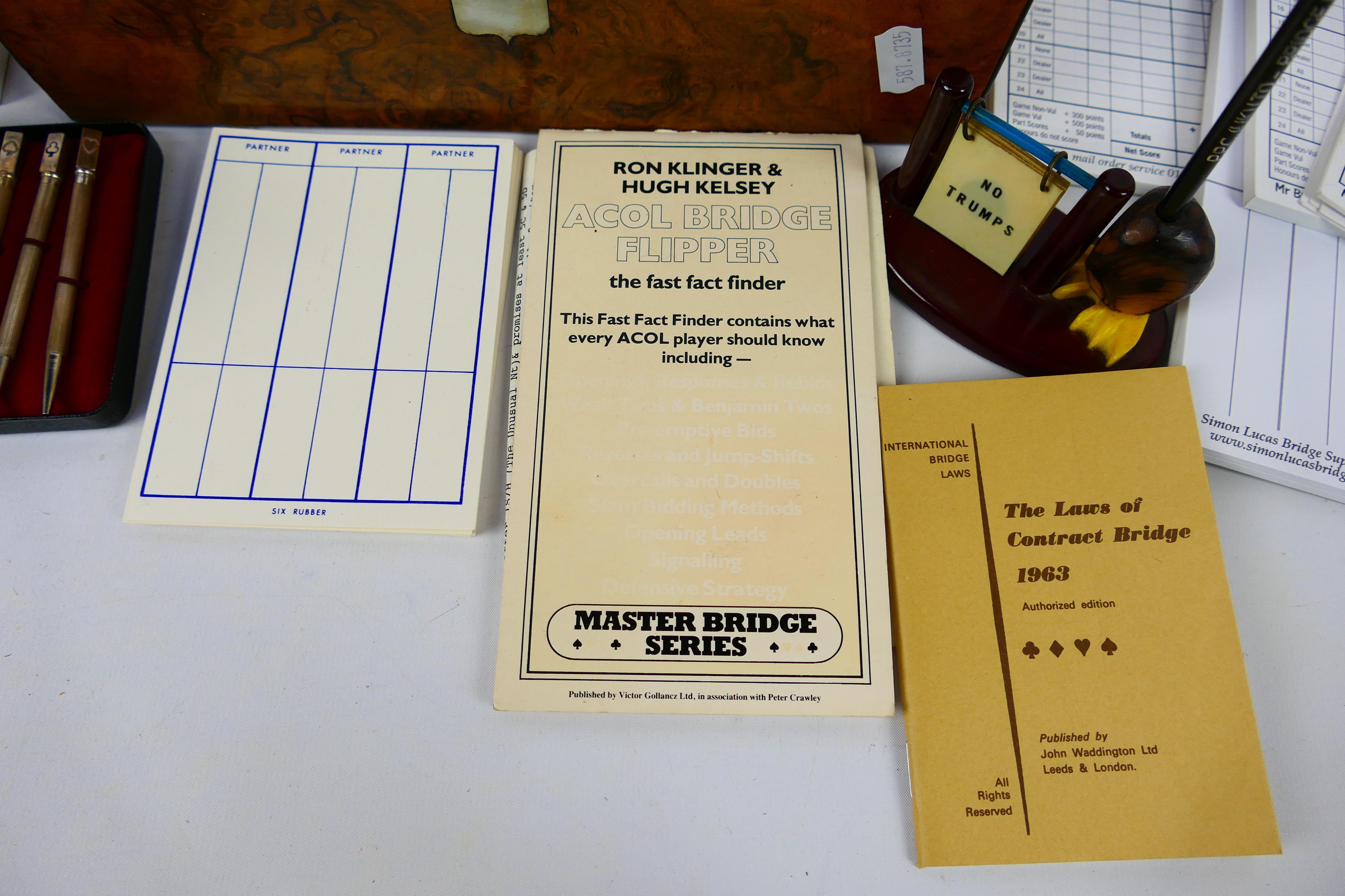 A wooden box containing bridge score cards and similar to include a set of four propelling pencils - Image 6 of 10