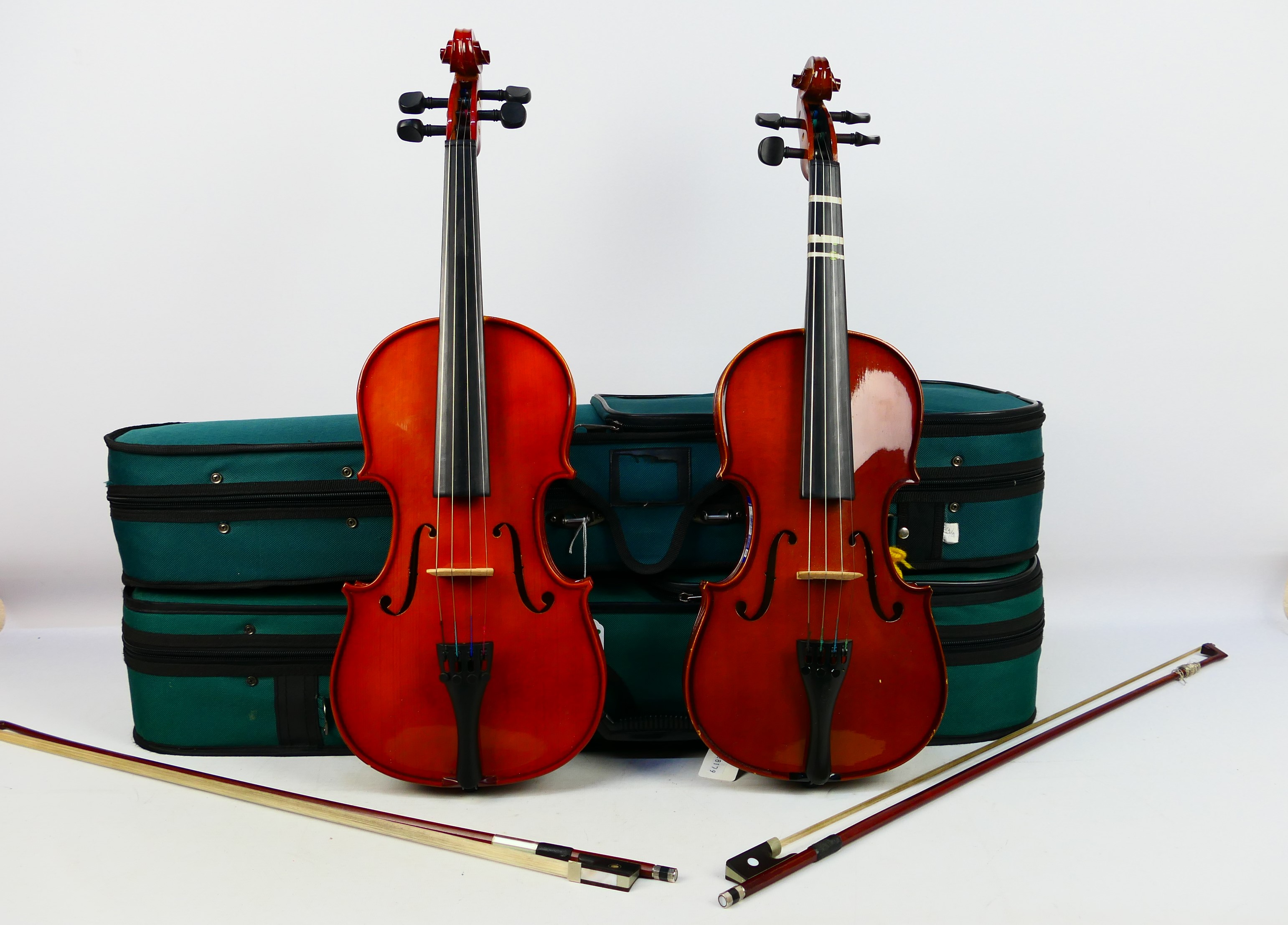 Two cased violins comprising a Stentor Student ST and an Antoni,