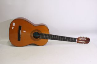 A BM Clasico Spanish made acoustic guitar. Appears in good condition.