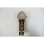 A lady's rose gold plated Radley wrist watch.