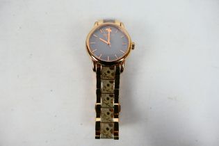 A lady's rose gold plated Radley wrist watch.