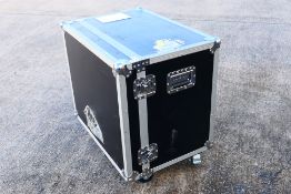 A medium sized professional flight case, raised on castors, approximately 75 cm x 74.5 cm x 52.5 cm.