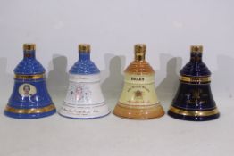 Bells - Four Wade decanters, with conten