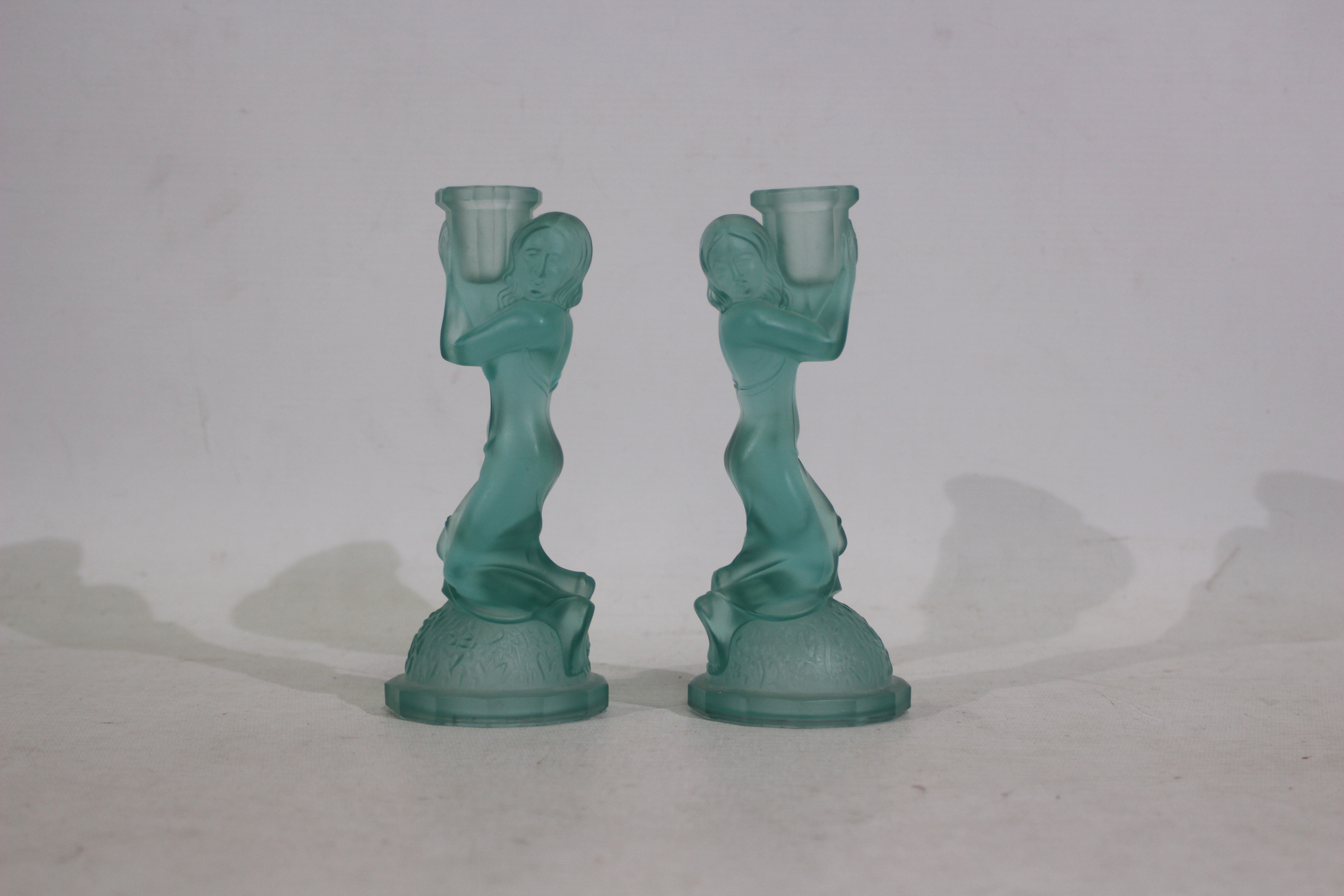 A pair of Art Deco turquoise glass candl