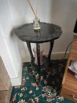 A circular topped occasional table, approximately 58 cm x 42 cm.