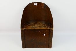 A child's vintage commode with carved decoration, approximately 49 cm (h).