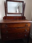 A vanity chest of three drawers with swing mirror, approximately 142 cm x 91 cm x 40 cm.