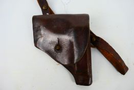 A World War Two (WW2 / WWII) brown leather Walther pistol holster.