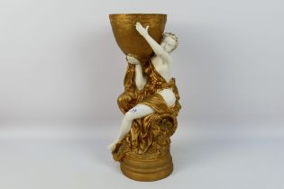 A decorative figural centrepiece, approximately 44 cm (h).