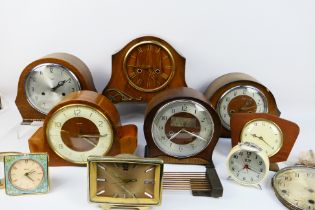 A collection of various clocks and clock parts.