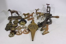 A collection of predominantly horse related brassware.