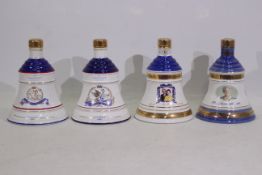 Bells - Four Wade decanters, with conten