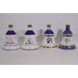 Bells - Four Wade decanters, with conten