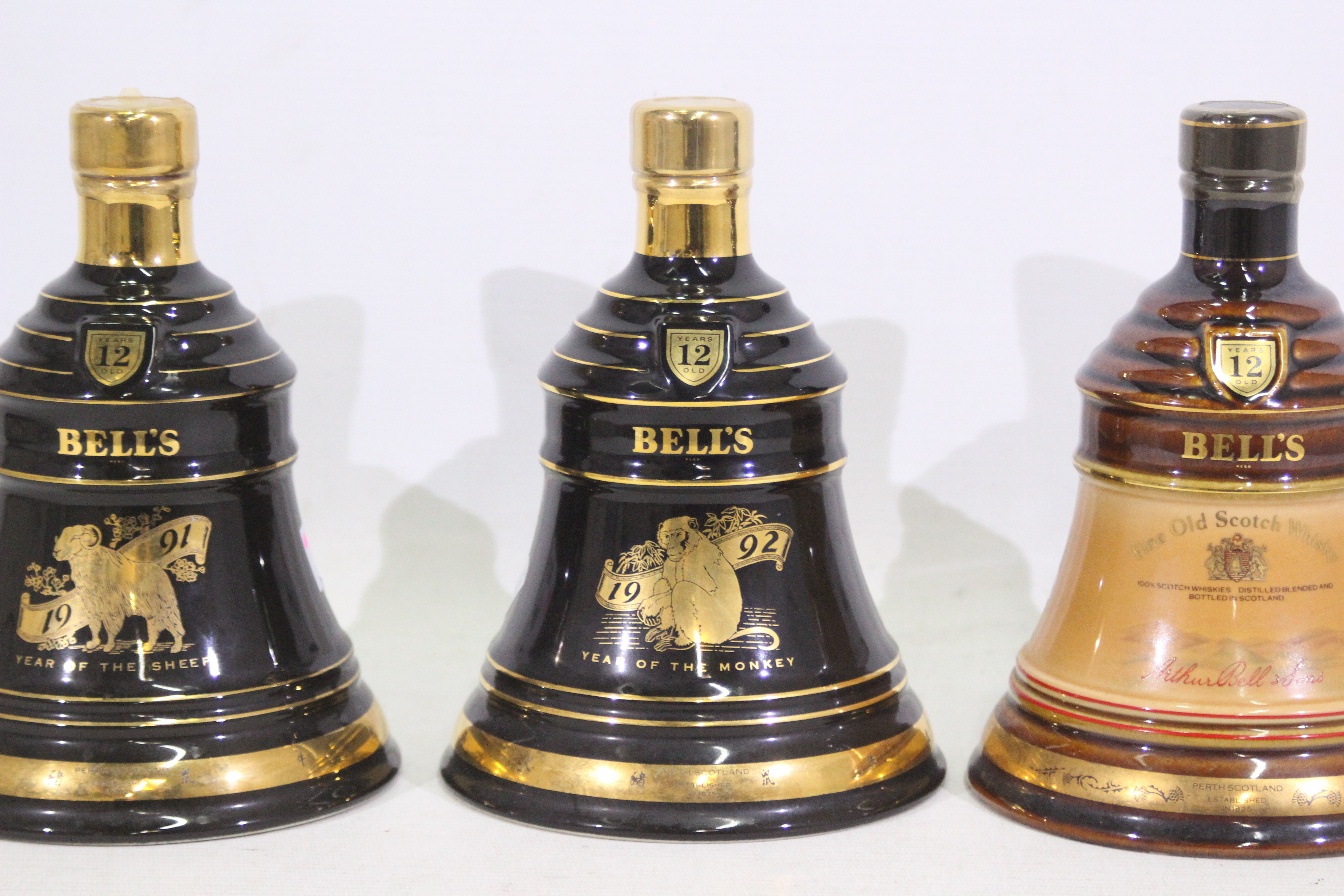 Bells - Three Wade decanters, with conte - Image 3 of 4